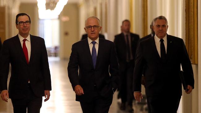 Joe Hockey (right) walks the halls of power with Malcolm Turnbull and US Treasury Secretary Steve Mnuchin. (Pic: Nathan Edwards)