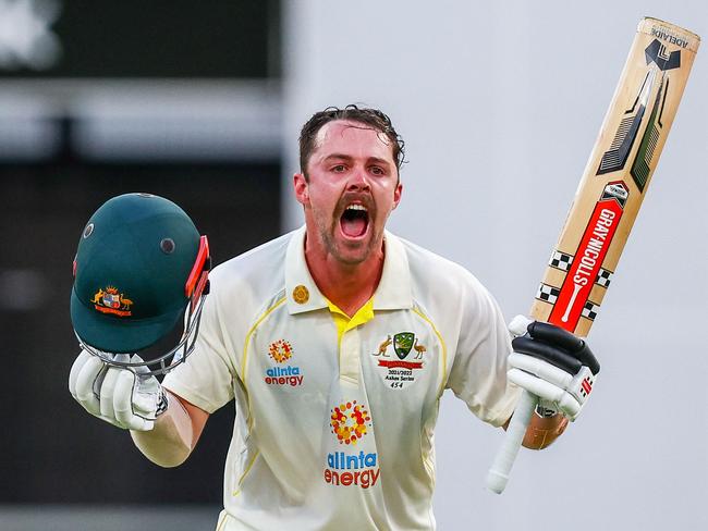 Australia's Travis Head celebrates his century during day two of the first Ashes cricket Test match between England and Australia at the Gabba in Brisbane on December 9, 2021. (Photo by Patrick HAMILTON / AFP) / -- IMAGE RESTRICTED TO EDITORIAL USE - STRICTLY NO COMMERCIAL USE --