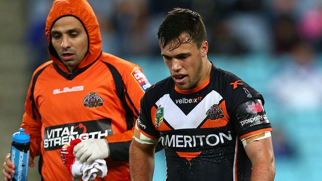 SYDNEY, AUSTRALIA - AUGUST 21: Luke Brooks of the Tigers leaves the field injured during the round 24 NRL match between the Canterbury Bulldogs and the Wests Tigers at ANZ Stadium on August 21, 2014 in Sydney, Australia. (Photo by Renee McKay/Getty Images)