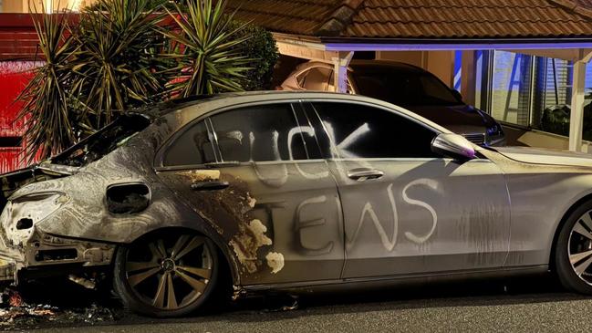 One of the cars destroyed by fire, a Mercedes, had “f..k Jews” sprayed on the side.