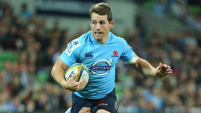 MELBOURNE, AUSTRALIA - MAY 23: Bernard Foley of the Waratahs makes a break during the round 15 Super Rugby match between the Rebels and the Waratahs at AAMI Park on May 23, 2014 in Melbourne, Australia. (Photo by Scott Barbour/Getty Images)