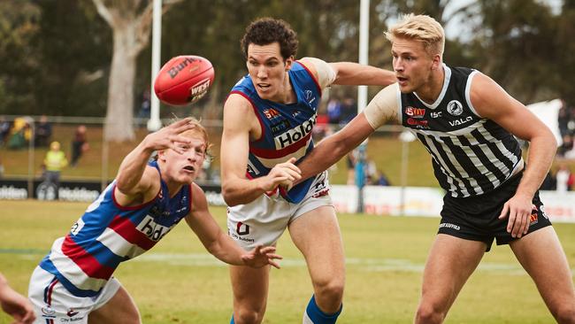 Darcy Fort (centre) has seen his dominant play at the Dogs rewarded with a spot on Geelong’s list. Picture: AAP/Matt Loxton