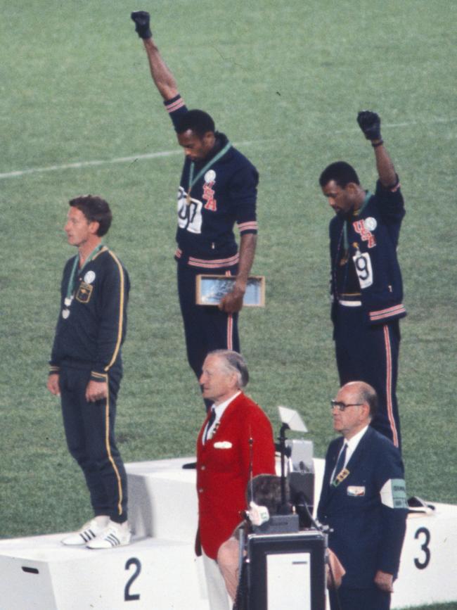 Peter Norman, left, on the podium in Mexico. Picture: Angelo Cozzi/Getty