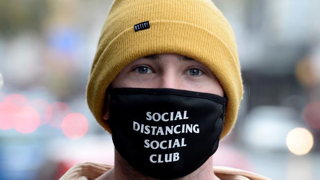 Callum Charles has started wearing a face mask in public, including when he's walking along Chapel Street in Melbourne. Picture: Andrew Henshaw