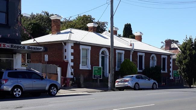 Police tape still blocks the footpath on Wellington St, Launceston, following the suspicious death of a woman in her home on Saturday night. Investigations are continuing into her death in this Wellington St home.