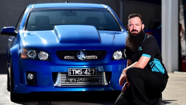 Townsville Mechanical Services office manager Ben Hall with a Holden VESS Commodore