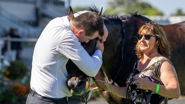 Trainer Patrick Kearney gives Yellowbrick Road a cuddle after his Lord Reims Stakes win. Picture: Makoto Kaneko