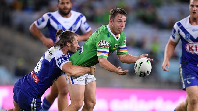 Sam Williams of the Raiders offloads a pass as he is tackled by Kieran Foran of the Bulldogs during the Round 12 NRL match between the Canterbury Bankstown Bulldogs and the Canberra Raiders at ANZ Stadium in Sydney, Saturday, June 1, 2019. (AAP Image/Dan Himbrechts) NO ARCHIVING, EDITORIAL USE ONLY