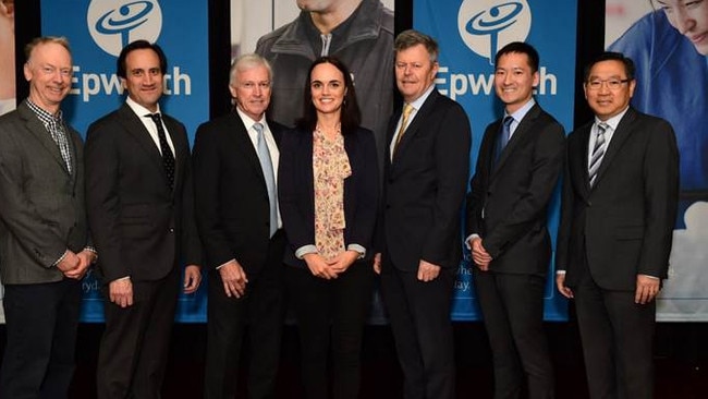 Heart surgeon Dr Robert Xu, second from right, attends a Cardiac Sciences Symposium with colleagues in October.