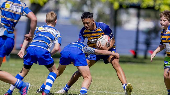 Day One of King of the Country rugby tournament at James Overell Park, Southport. possible. Sunshine Coast Invitational Barbarians U13s (Blue/yellow with ball) v USQ Saints U13s. Picture: Jerad Williams