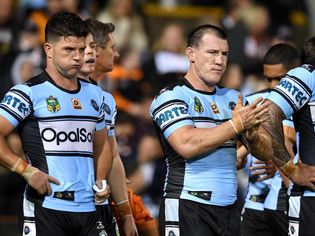 (l to R) Chad Townsend, Paul Gallen and Andrew Fifita of the Sharks look on following a try scored by Kevin Naiqama of the Tigers during the round 9 NRL match between the West Tigers and the Cronulla Sutherland Sharks at Leichhardt Oval in Sydney on Saturday, April 29, 2017. (AAP Image/Paul Miller) NO ARCHIVING, EDITORIAL USE ONLY