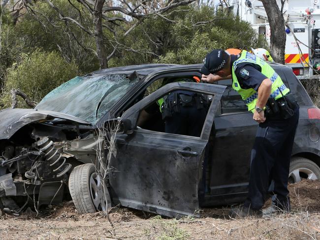 WARNING PLEASE PIXELATE CAR REGO NUMBER PLATE - Major Crash Investigators, Police, SES and Tow truck workers at the crash scene of motor vehical accident on the Yorke Peninsula over the Easter weekend.Where a Woman, 47, killed in crash on Copper Coast Highway near KadinaThe accident happened at 7.25am on the Copper Coast Highway about 4km east of Kadina.The driver and sole occupant of the car, a 47-year-old Yorke Peninsula woman, died at the scene. (AAP/Emma Brasier)