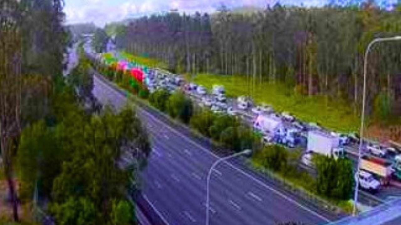 Truckie fights for life after crash brings Pacific Mwy to standstill ...