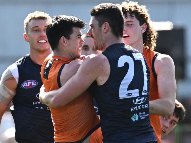 MELBOURNE, AUSTRALIA - SEPTEMBER 02: Matthew Kennedy and Marc Pittonet of the Blues have a push and shove during match simulation at a Carlton Blues AFL training session at Ikon Park on September 02, 2023 in Melbourne, Australia. (Photo by Quinn Rooney/Getty Images)