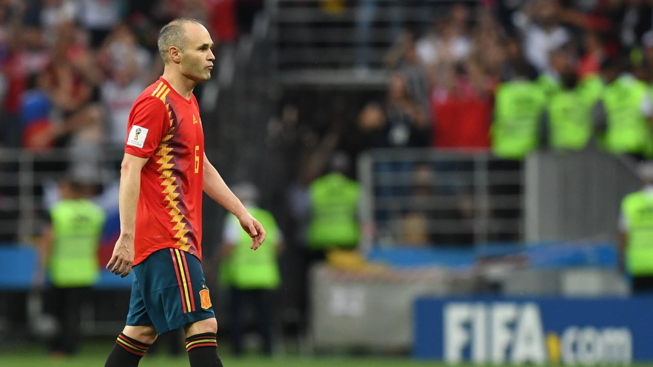 Spain's midfielder Andres Iniesta reacts after the penalty shoot-out
