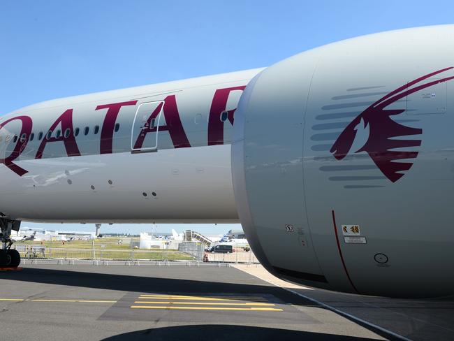 (FILES) This file photo taken on June 18, 2017 shows a Qatar Airways Boeing 777-300  on the Tarmac of Le Bourget airport on the eve of the opening of the International Paris Air Show. Qatar Airways has notified American Airlines it wants to buy about a 10 percent stake in the US carrier, which confirmed the move on June 22, 2017 in a securities filing.Qatar Airways disclosed that it planned to buy at least $808 million in shares, and Qatar Airways' chief executive told his counterpart at American that the carrier sought a stake of about 10 percent, American Airlines said.   / AFP PHOTO / ERIC PIERMONT