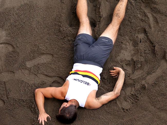 TOKYO, JAPAN - AUGUST 04:  Thomas van der Plaetsen of Team Belgium is hurt while competing in the Men's Decathlon Long Jump on day twelve of the Tokyo 2020 Olympic Games at Olympic Stadium on August 04, 2021 in Tokyo, Japan. (Photo by Rob Carr/Getty Images)