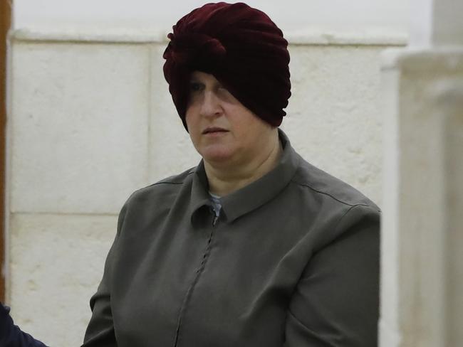 Malka Leifer, a former Australian teacher accused of dozens of cases of sexual abuse of girls at a school, arrives for a hearing at the District Court in Jerusalem on February 27, 2018, - Israel on February 12 arrested the Australian woman who is wanted in her home country on child sex abuse charges, police announced. The suspect has been living in a West Bank settlement for the past decade following a complaint filed against her by a former student at a Jewish ultra-Orthodox school she ran in Melbourne. (Photo by AHMAD GHARABLI / AFP)