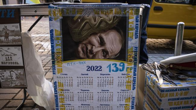 A calendar showing Russian President Vladimir Putin and other souvenirs are on sale on a street in central Kyiv, Ukraine. Picture: Ed Ram/Getty Images