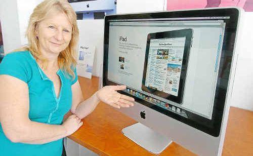 Donna Huth, of Bundaberg Technology Solutions, is excited about the new Apple iPad, which will be in Australia in April. . Picture: Rob Barich