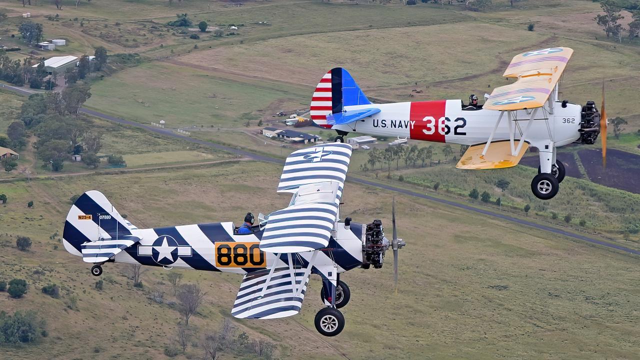 Aerotec Toowoomba pilots Matt Handley and Tim Berry flew the two Boeing PT-17 Stearmans as a special tribute to those who lost their lives in a surprise military strike on Pearl Harbour. Picture: Lenn Bayliss