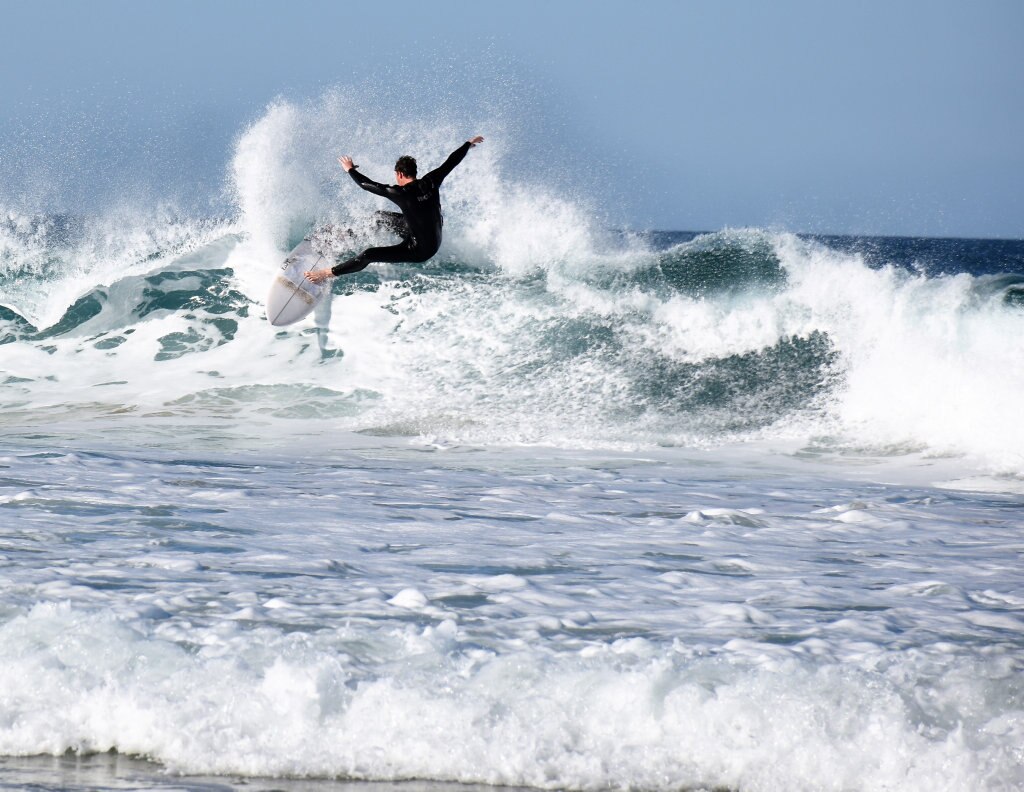 Surfers and bodyboard riders making the most of the waves at Kawana on the weekend. Picture: Mark Furler