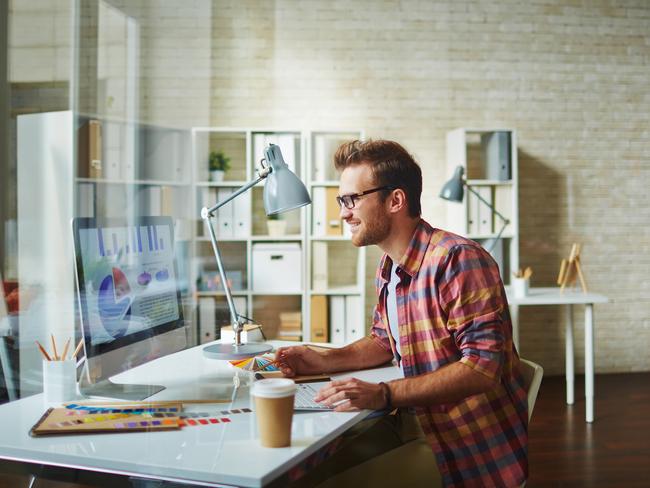 Male designer using computer at office