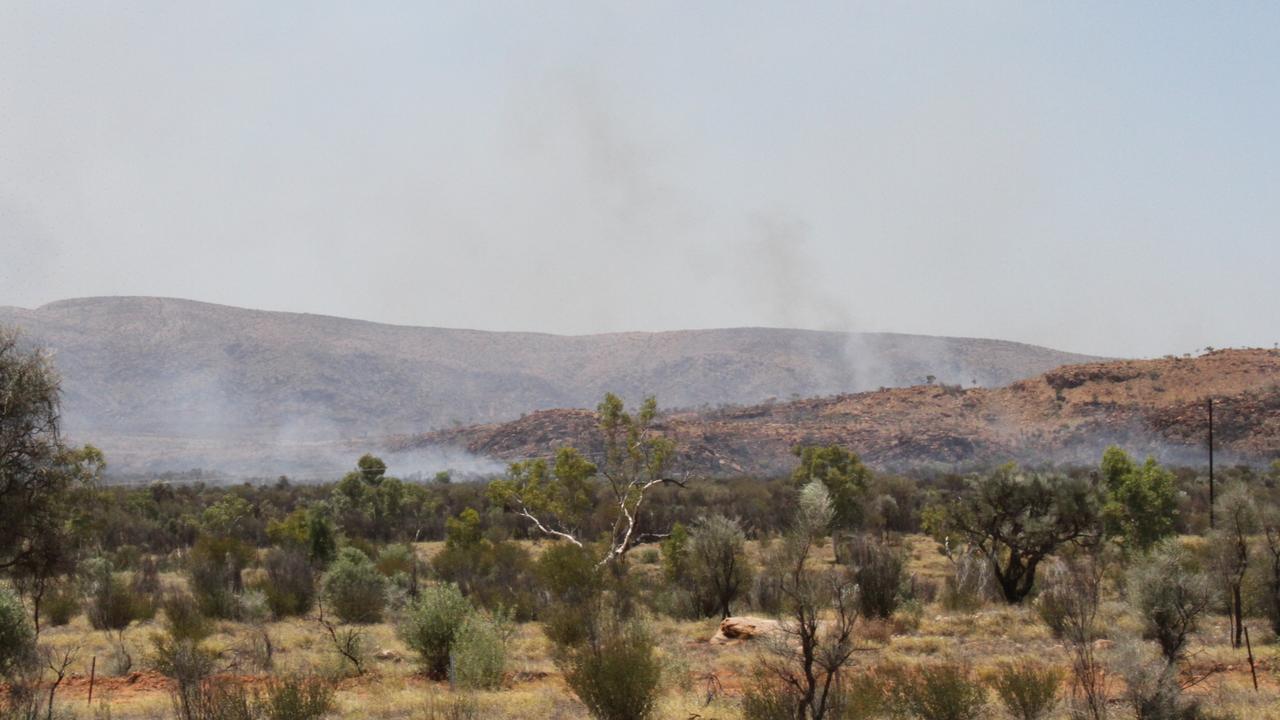 Fireys battle small spot fires as West MacDonnell fire crosses ranges