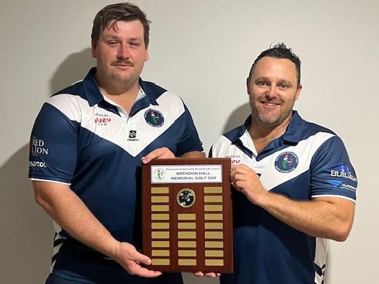 Lachlan Hall and Rockhampton Brothers' senior president Tom Simpson with the Brendon Hall Memorial Golf Day shield, which will be presented for the first time on Sunday.