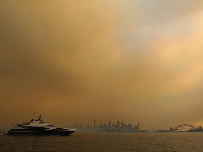 Smoke haze from bushfires has blanketed the Sydney CBD. Picture: AAP/Steven Saphore