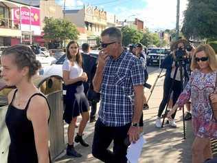 Chloe-May and her father Matthew Kabealo exit Murwillumbah Courthouse following a coroners inquest into the deaths of Chloes mother, Stephanie King, and siblings Ella-Jane and Jacob. Picture: Aisling Brennan