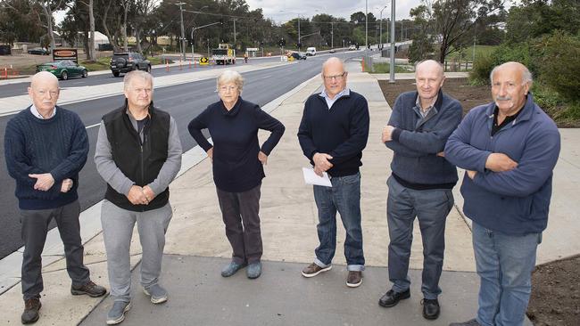 Frustrated Yan Yean Rd homeowners Ian Dunn, Graeme McLennan, Joan Dunn, Michael Sealy, Neal Forbes and Joe Miraglia are demanding answers. Picture: Ellen Smith