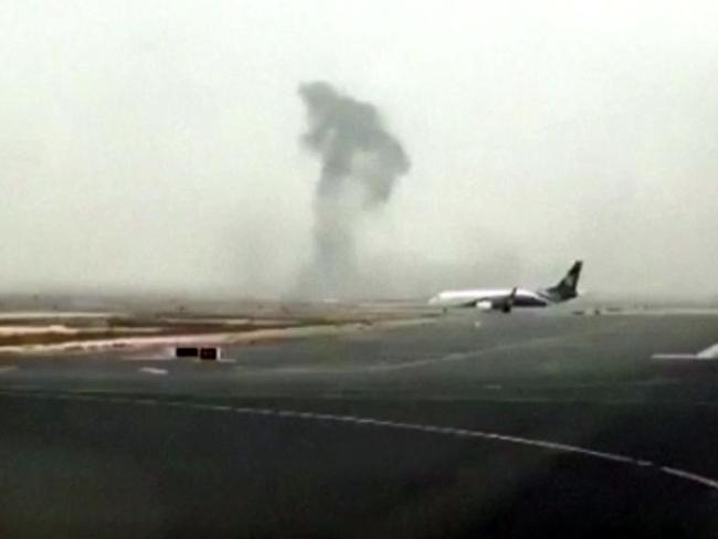 This image made from video shows smoke rising after an Emirates flight crash landed at Dubai International Airport. Picture: Hayen Ayari via AP