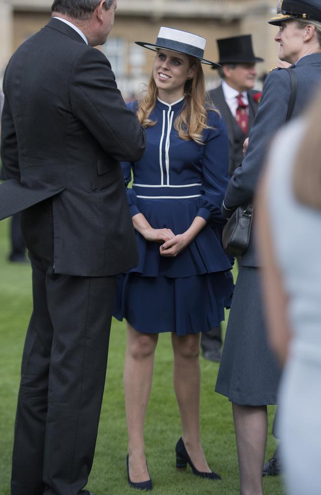 Princess Beatrice talks to guests during a garden party at Buckingham Palace on May 16, 2017 in London, England. Picture: Getty