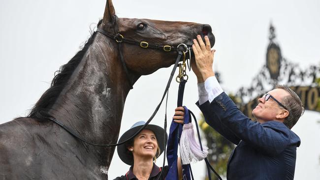 Trainer David Vandyke greets Alligator Blood after his CS Hayes Stakes victory at Flemington racecourse. Picture: AAP Image/Vince Caligiuri