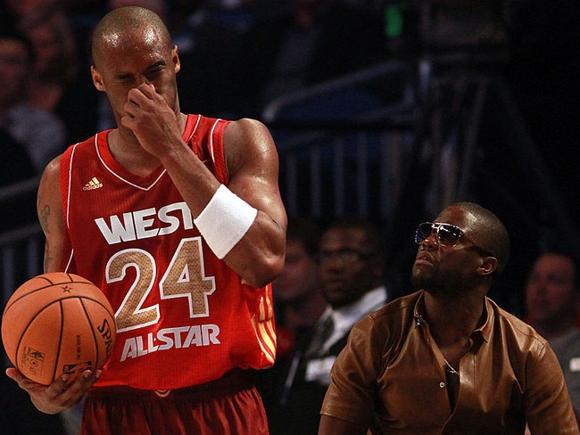 ORLANDO, FL - FEBRUARY 26:  Kobe Bryant #24 of the Los Angeles Lakers and the Western Conference reacts after he drew blood on the receiving end of a hard foul as comedian Kevin Hart looks on (R) during the 2012 NBA All-Star Game at the Amway Center on February 26, 2012 in Orlando, Florida.  NOTE TO USER: User expressly acknowledges and agrees that, by downloading and or using this photograph, User is consenting to the terms and conditions of the Getty Images License Agreement.  (Photo by Ronald Martinez/Getty Images)