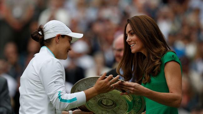 Barty receives the trophy from Britain's Catherine, Duchess of Cambridge. Picture: AFP