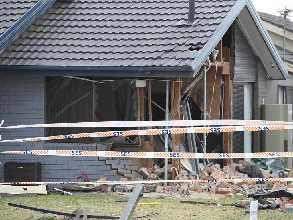 A neighbour’s fence is also destroyed. Picture: David Crosling