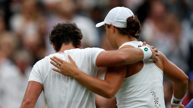 Australia's Ashleigh Barty embraces Spain's Carla Suarez Navarro. Picture: AFP