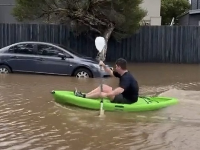 Man in canoe around Safety Beach. Picture: Paul Dowsley