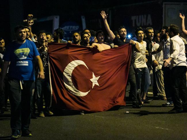 People take streets near the Fatih Sultan Mehmet bridge during clashes with military forces in Istanbul. Picture: Gurcan Ozturk