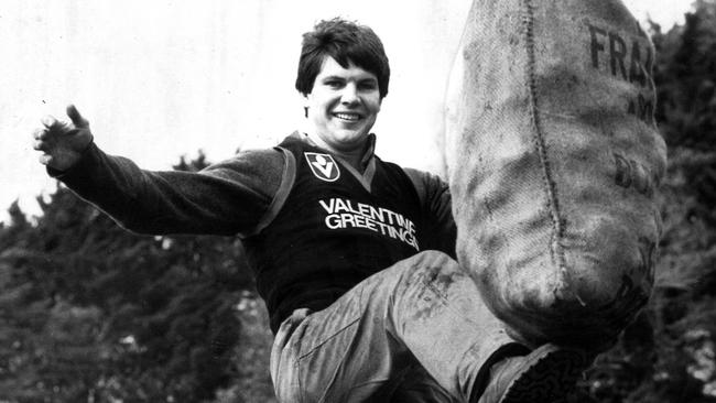 Danny Frawley kicking a bag of potatoes in 1985.