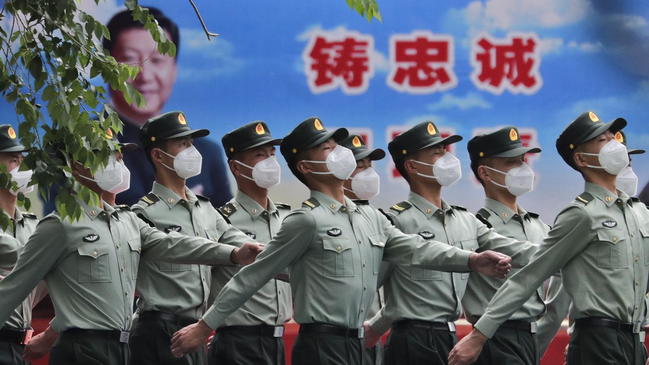 China is hitting out at countries at the same time as it is getting heat for coronavirus and list treatment of the Hong Kong autonomous region. Picture: AP Photo/Andy Wong