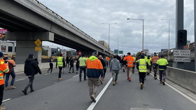 Construction workers make their way on to the West Gate Bridge. Picture: Suzan Delibasic