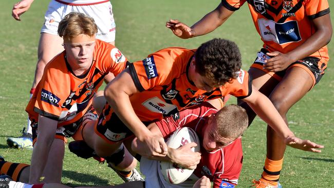 Tigers player Xavier Asi tackles hard. Picture, John Gass