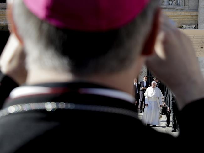 A bishop takes photos of Pope Francis during his weekly general audience, in St. Peter's Square, at the Vatican, Wednesday, Nov. 8, 2017. (AP Photo/Andrew Medichini)