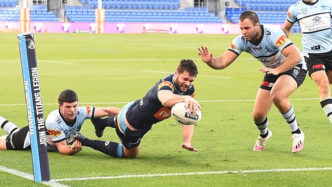 GOLD COAST, AUSTRALIA - JULY 04: Anthony Don of the Titans scores a try during the round eight NRL match between the Gold Coast Titans and the Cronulla Sharks at Cbus Super Stadium on July 04, 2020 in Gold Coast, Australia. (Photo by Ian Hitchcock/Getty Images)