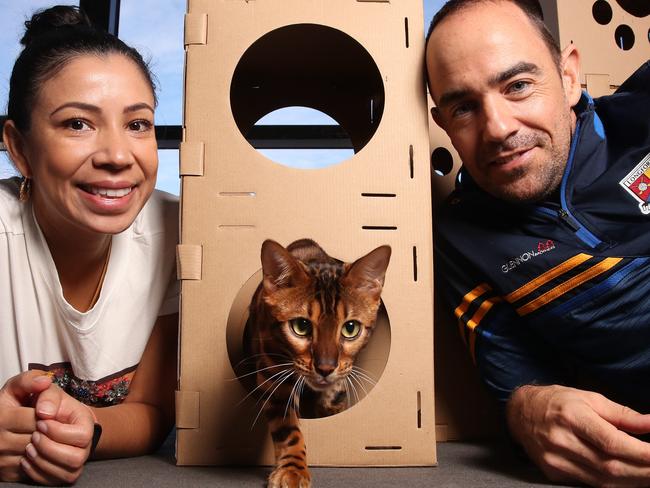 Simon Quinn and Maria Madero Quinn of Surfers Paradise, with their cat, Kevin. Picture: Glenn Hampson