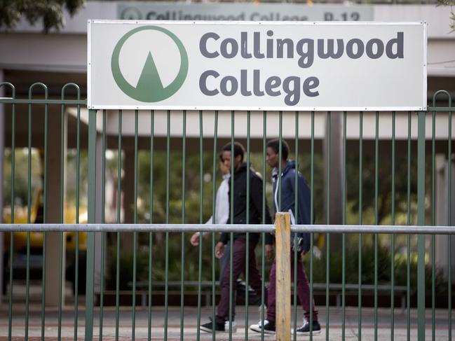 Students walk past a sign for Collingwood College, where Gok Shoul was involved in a notorious brawl in 2017. Picture: Nathan Dyer