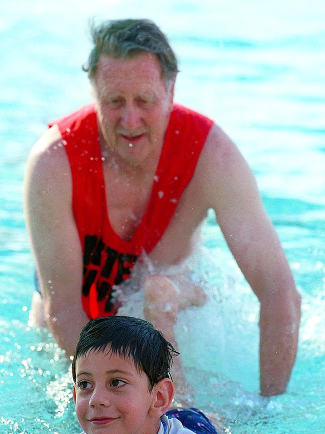 Kevin Hession teaches Benjamin Ayoub how to swim in 2000.